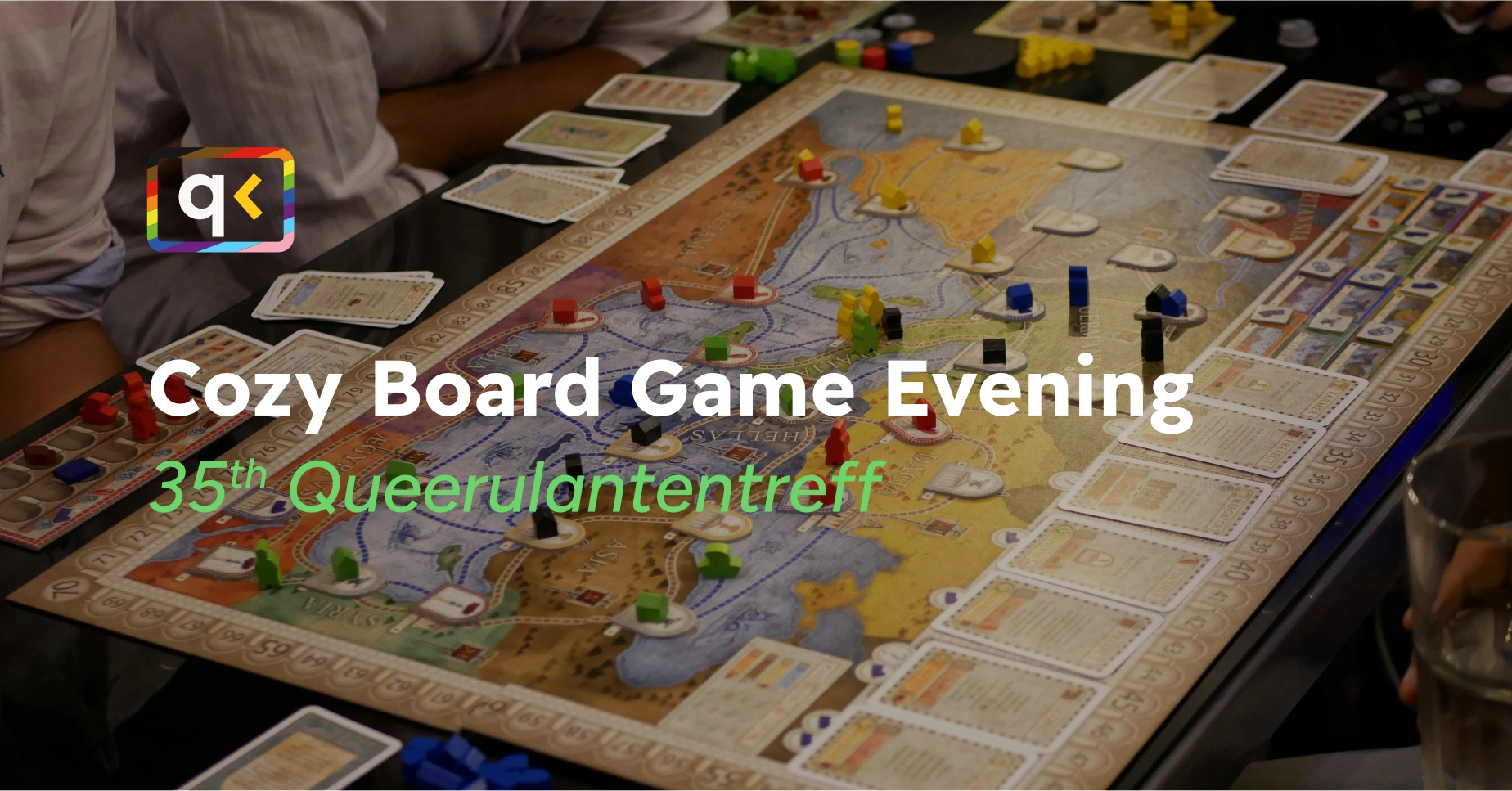 The background shows a board game. In front of the background is the title and subtitle of the event.